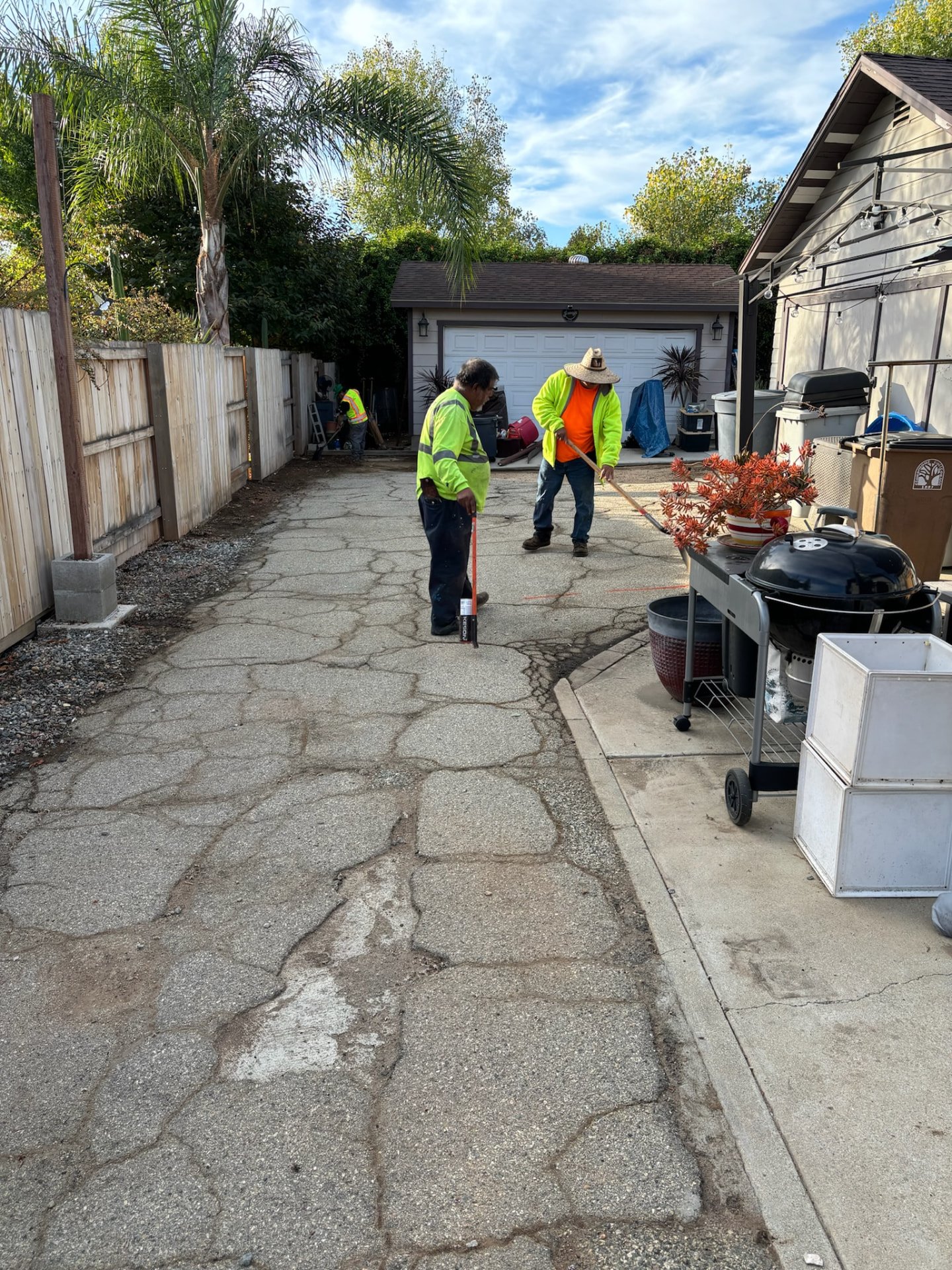 Cracked, broken driveway before demo